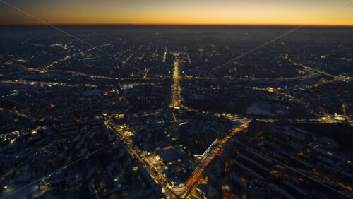 Video - Aerial drone hyperlapse timelapse of Chisinau city covered in snow at night. Winter in Moldova