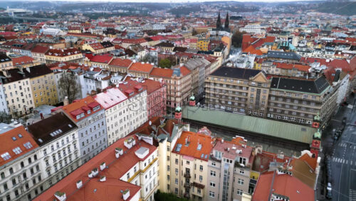 Video - Aerial drone view of Prague city with lots of buildings with red roofs. Basilica of St. Peter and St. Paul in background. Czech Republic