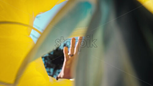 Video - Man throwing a medical mask into a trash can. View from inside the can. Slow motion