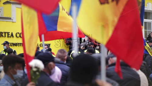 Video - CHISINAU, MOLDOVA - APRIL 28, 2021: People protesting for snap elections in front of constitutional court building. Slow motion