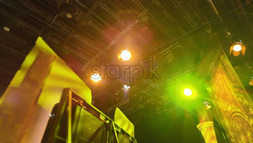Video - Flashing studio lights equipment on the ceiling of a TV set