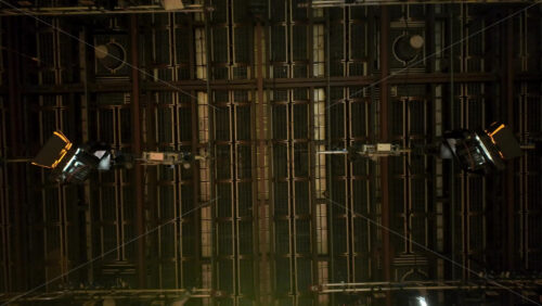 Video - Flashing studio lights equipment on the ceiling of a TV set