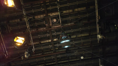 Video - Flashing studio lights equipment on the ceiling of a TV set