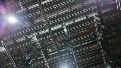 Video - Flashing studio lights equipment on the ceiling of a TV set
