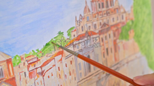 Video - Female hands painting a picture