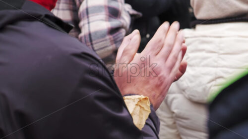 Video - Clapping man at the protest with a lot of people