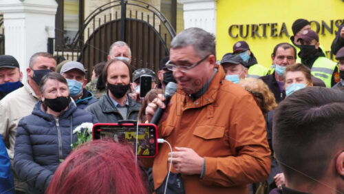 Video - CHISINAU, MOLDOVA - APRIL 28, 2021: Man talking in the microphone. People protesting for snap elections in front of constitutional court building
