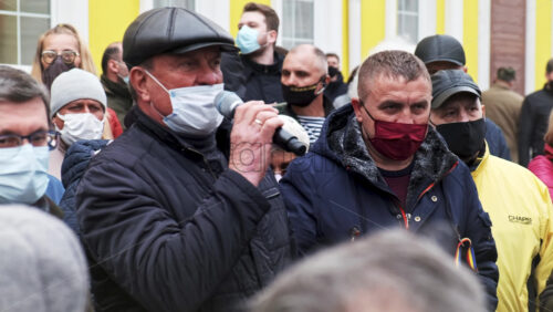 Video - CHISINAU, MOLDOVA - APRIL 28, 2021: Man talking in the microphone. People protesting for snap elections in front of constitutional court building