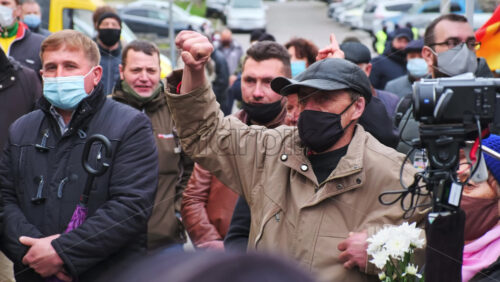 Video - CHISINAU, MOLDOVA - APRIL 28, 2021: Shouting group of people. People protesting for snap elections in front of constitutional court building
