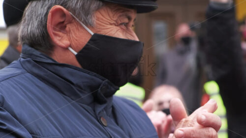 Video - CHISINAU, MOLDOVA - APRIL 28, 2021: Clapping man. People protesting for snap elections in front of constitutional court building