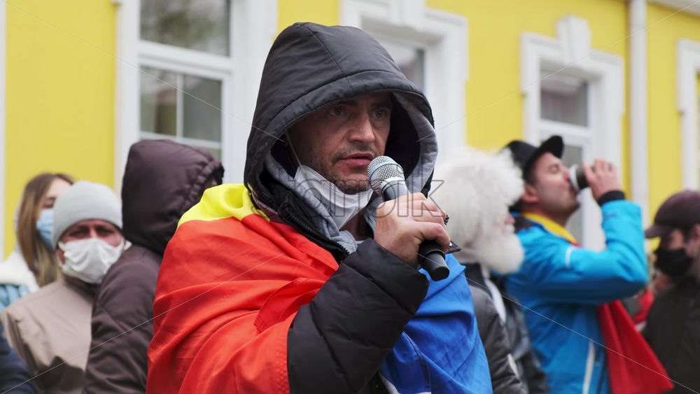 Video - CHISINAU, MOLDOVA - APRIL 28, 2021: Man talking in the microphone. People protesting for snap elections in front of constitutional court building