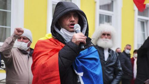 Video - CHISINAU, MOLDOVA - APRIL 28, 2021: Man talking in the microphone. People protesting for snap elections in front of constitutional court building