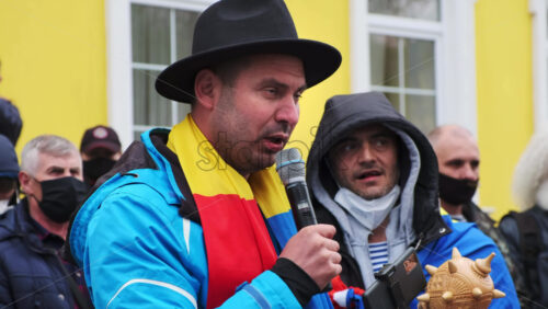 Video - CHISINAU, MOLDOVA - APRIL 28, 2021: Man talking in the microphone. People protesting for snap elections in front of constitutional court building