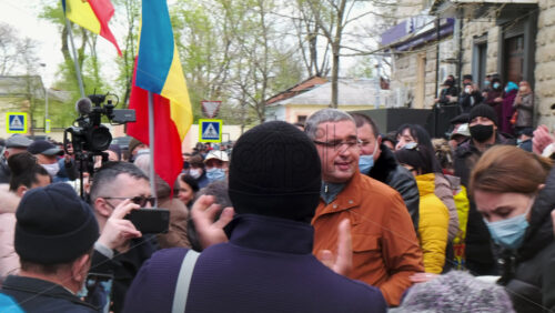 Video - CHISINAU, MOLDOVA - APRIL 28, 2021: Man talking in the microphone. People protesting for snap elections in front of constitutional court building