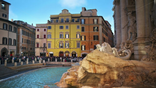 Video - Rome, Italy - February 13, 2024: The Trevi Fountain with walking tourists at sunset