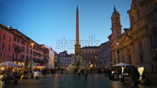 Video - Rome, Italy - February 13, 2024: Fountain of the Four Rivers located in Navona square. City square at sunset