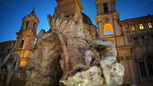 Video - Fountain of the Four Rivers located in Navona square. Rome city square at sunset. Italy