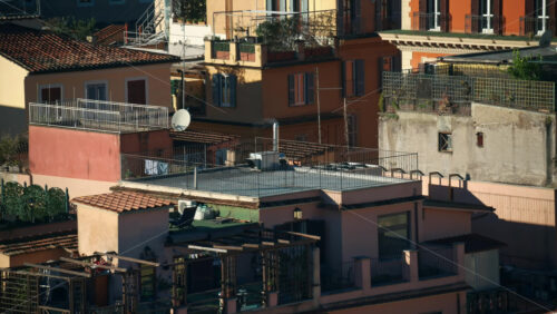 Video - Aerial view of red-tiled rooftops at sunset in Rome, Italy