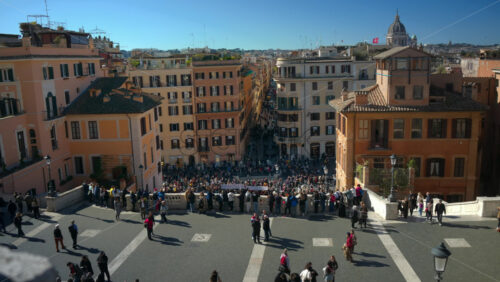 Video - Rome, Italy - February 14, 2024: Tourists walking on Spanish square in sunlight