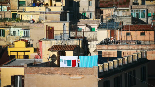 Video - Aerial view of red-tiled rooftops at sunset in Rome, Italy