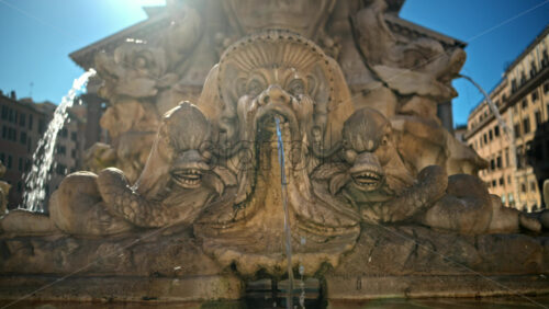 Video - Close up view of the Fountain of the Pantheon in sunlight. Slow motion
