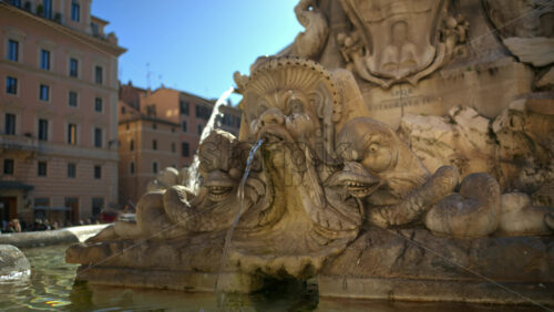 Video - Close up view of the Fountain of the Pantheon in sunlight. Slow motion