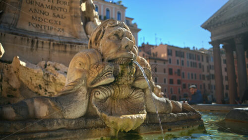 Video - Rome, Italy - February 13, 2024: Close up view of the Fountain of the Pantheon in sunlight. Slow motion