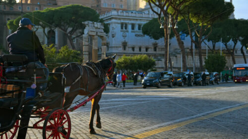 Video - Rome, Italy - February 15, 2024: People on carriage ride on the streets of Rome