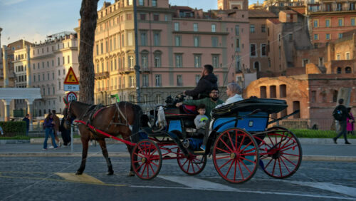 Video - Rome, Italy - February 15, 2024: People on carriage ride on the streets of Rome