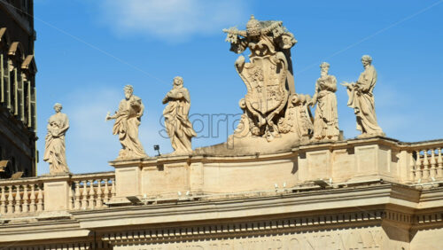 Video - Statues on the Facade of St. Peter's Basilica on the blue sky background, in St. Peter's Square, Vatican City, Rome, Italy