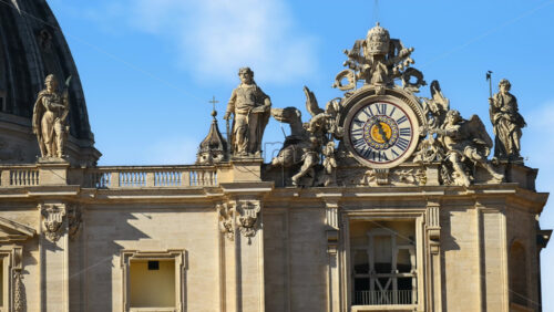 Video - Close up of one of two clocks atop of Saint Peter's Basilica facade, Vatican City, Rome, Italy