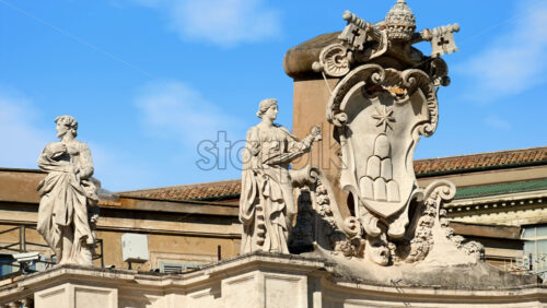 Video - Statue on the Facade of St. Peter's Basilica on the blue sky background, in St. Peter's Square, Vatican City, Rome, Italy