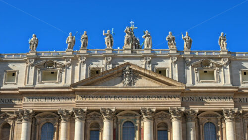 Video - Statues on the Facade of St. Peter's Basilica on the blue sky background, in St. Peter's Square, Vatican City, Rome, Italy