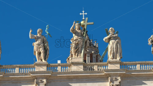 Video - Statues on the Facade of St. Peter's Basilica on the blue sky background, in St. Peter's Square, Vatican City, Rome, Italy