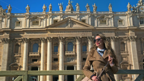 Video - Brunette, young woman in front of the St. Peter's Basilica, Vatican City, Rome, Italy