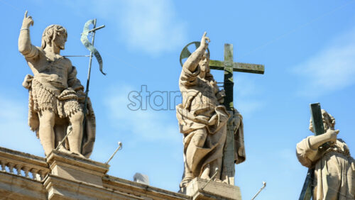 Video - Statues on the Facade of St. Peter's Basilica on the blue sky background, in St. Peter's Square, Vatican City, Rome, Italy