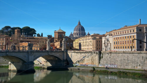 Video - Rome, Italy - February 15, 2024: Ponte Sant'Angelo across River Tiber with city view on the background