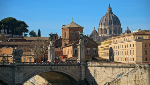 Video - Rome, Italy - February 15, 2024: Ponte Sant'Angelo across River Tiber with city view on the background