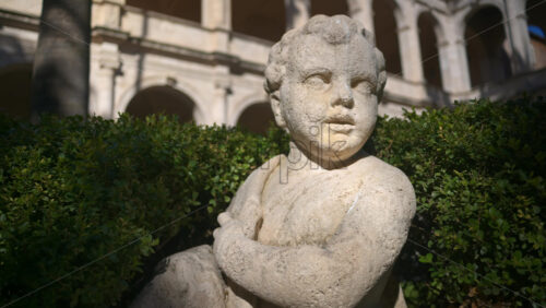 Video - A cherub in the garden of the Basilica of St Mark Evangelist at Campidoglio. Rome, Italy