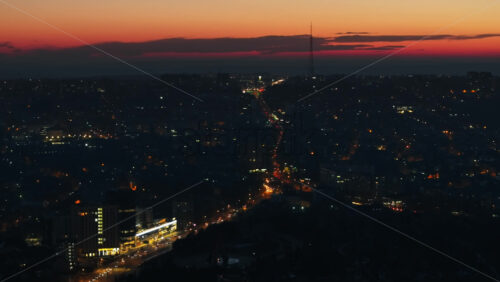Video - Aerial drone view of Chisinau city with moving traffic at sunset