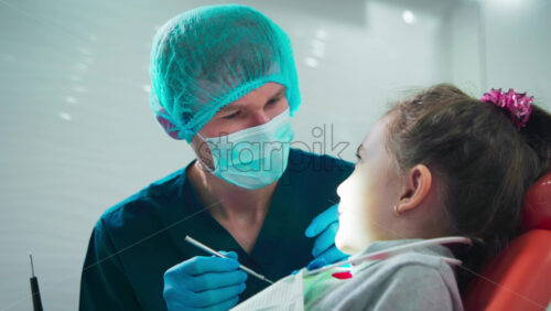 Video - Doctor in the dental office with kid patient at the examination