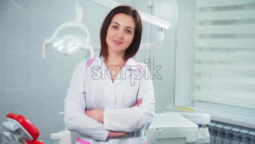 Video - Doctor in the dental office looking into the camera
