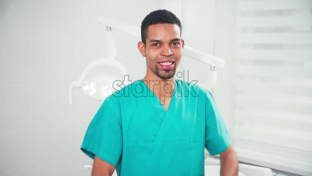 Video - Doctor in the dental office watchng into the camera