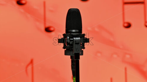 Video - Close-up of microphone on a red background on the backstage of a TV set