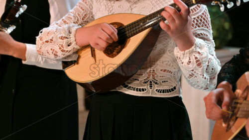 Video - Close-up of three women playing the mandolin