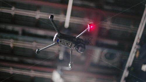 Video - Drone flying and filming near flashing studio lights and camera equipment on a TV set