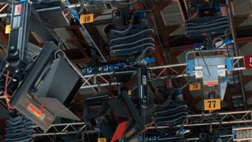 Video - Close up of studio lights equipment on the ceiling of a TV set