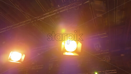 Video - Flashing studio lights equipment on the ceiling of a TV set
