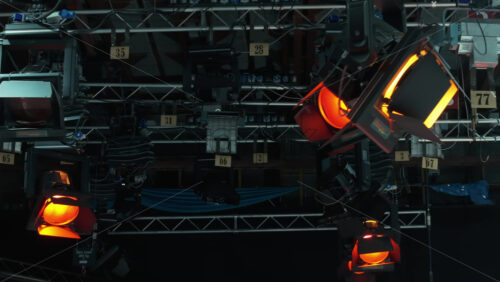 Video - Flashing studio lights equipment on the ceiling of a TV set