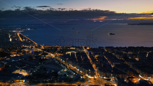 Video - Aerial drone view of Thessaloniki coastline at the sunset. The Aegean Sea in Central Macedonia in Greece